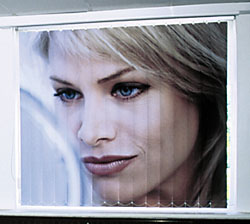 Image of a woman checking her makeup - printed on vertical blinds.