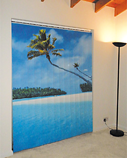 Image of patio door with custom printed blinds showing a beach image.